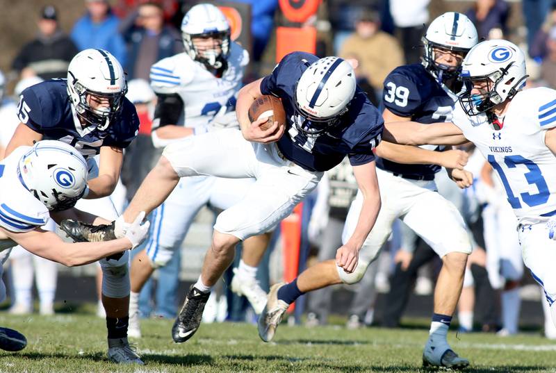 Cary-Grove’s Peyton Seaburg moves the ball against Geneva in IHSA Class 6A quarterfinal playoff football action at Cary Saturday.