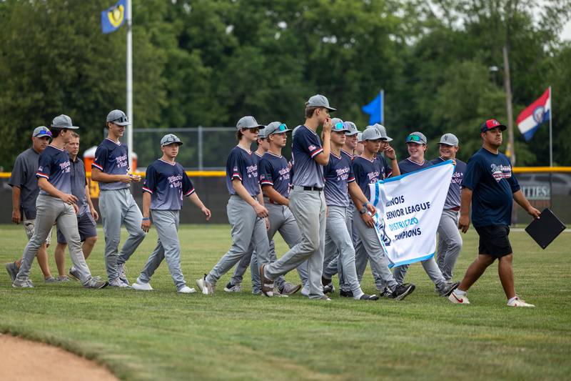 Illinois Valley District 20 Champions walk off field at the Central Region Tournament, opening Ceremony on Friday, July 11, 2025 at Washington Park in Peru.