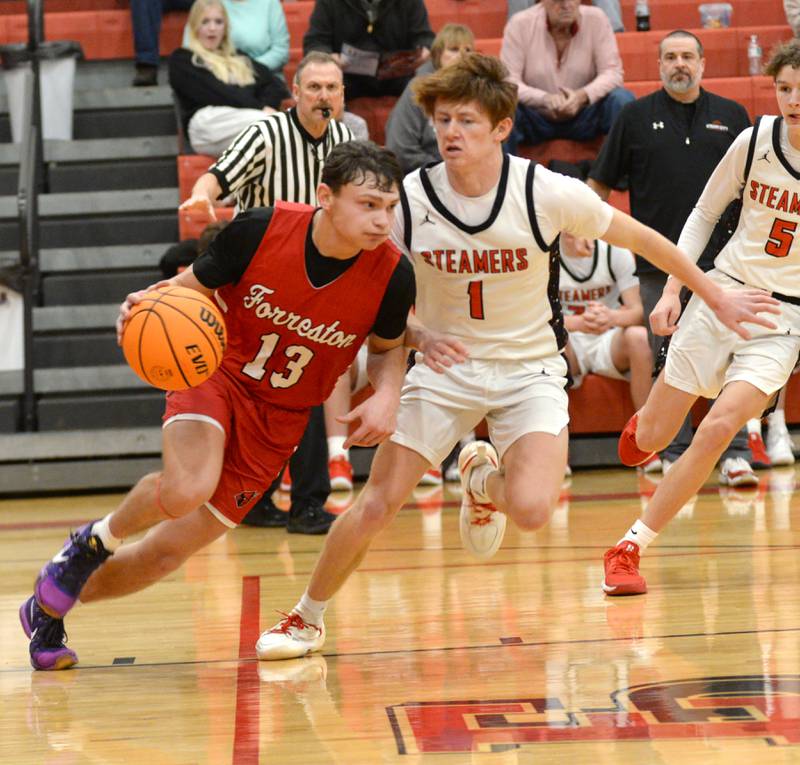 Forreston's Kendall Erdmann (13) drives against a Fulton defender during a Friday, Dec. 27, 2024 game at the Cliff Warkins Memorial Basketball Tournament at Erie High School.