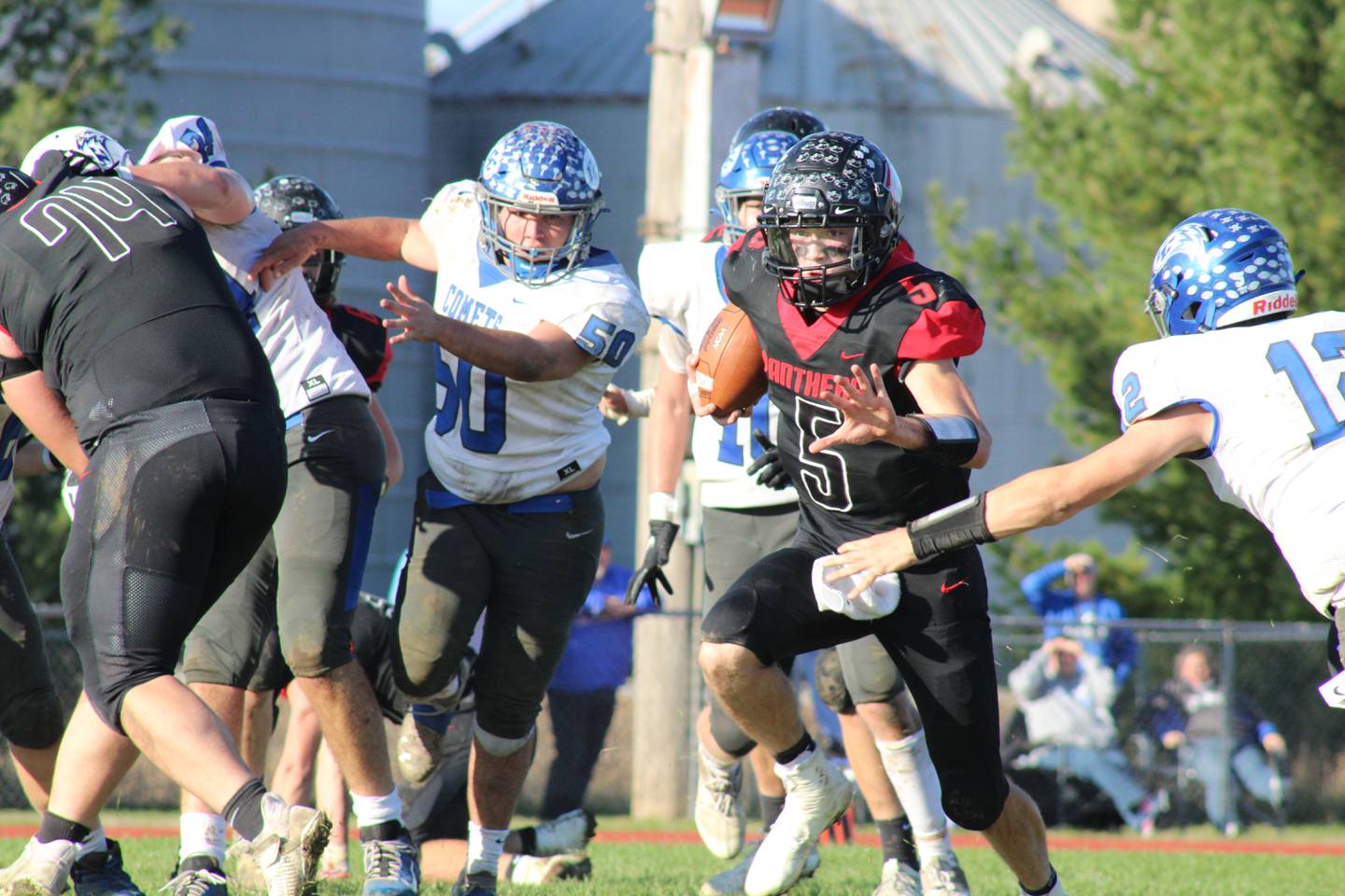 Erie-Prophetstown quarterback Kolby Franks (5) runs through a gap in a Class 2A playoff game on Saturday, Oct. 30, 2021, against Clifton Central at Erie High School.