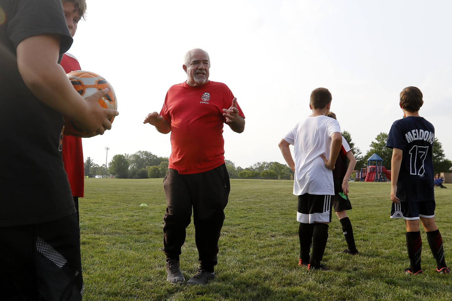 Cary Soccer Association coach Mike Goldman works with youth in the league at Cary Grove Park on Thursday, July 22, 2021 in Cary. Goldman, 70, is a recovered heroin addict from 45 years ago through Gateway who has focused his efforts into various volunteer opportunities, including coaching youth soccer.
