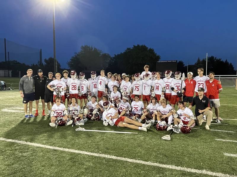 Hinsdale Central boys lacrosse posing after their 12-11 victory over Batavia in the regional semifinal on Monday hosted at Wheaton Academy. Photo by Jake Bartelson.