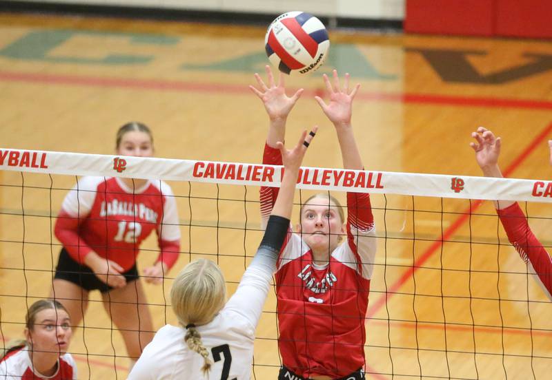 L-P's Maggie Boudreau blocks a spike from Sycamore's Madilyn Patton on Tuesday, Sept. 23, 2025 in Sellett Gymnasium at L-P High School.