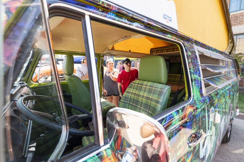 Riley Sus (right), checks out the inside of Jeffrey Tkachuk’s ’78 VW Westphalia Sunday, Aug. 25, 2024, at Amboy’s Depot Days. The camper van was wrapped in a colorful Grateful Dead motif.