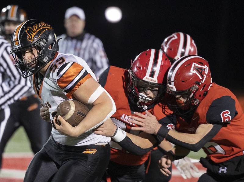 Millegeville’s Dalton Adamec runs a recovered fumble against Amboy Friday, Nov. 22, 2024, during the 8-man football championship in Monmouth.