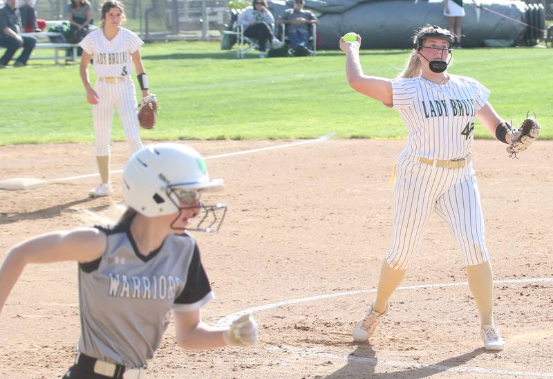 St. Bede pitcher Reagan Stoudt throws to first to force out Woodland/Flanagan-Cornell's Jaylei Leininger on Monday, April 29, 2024 at St. Bede Academy.