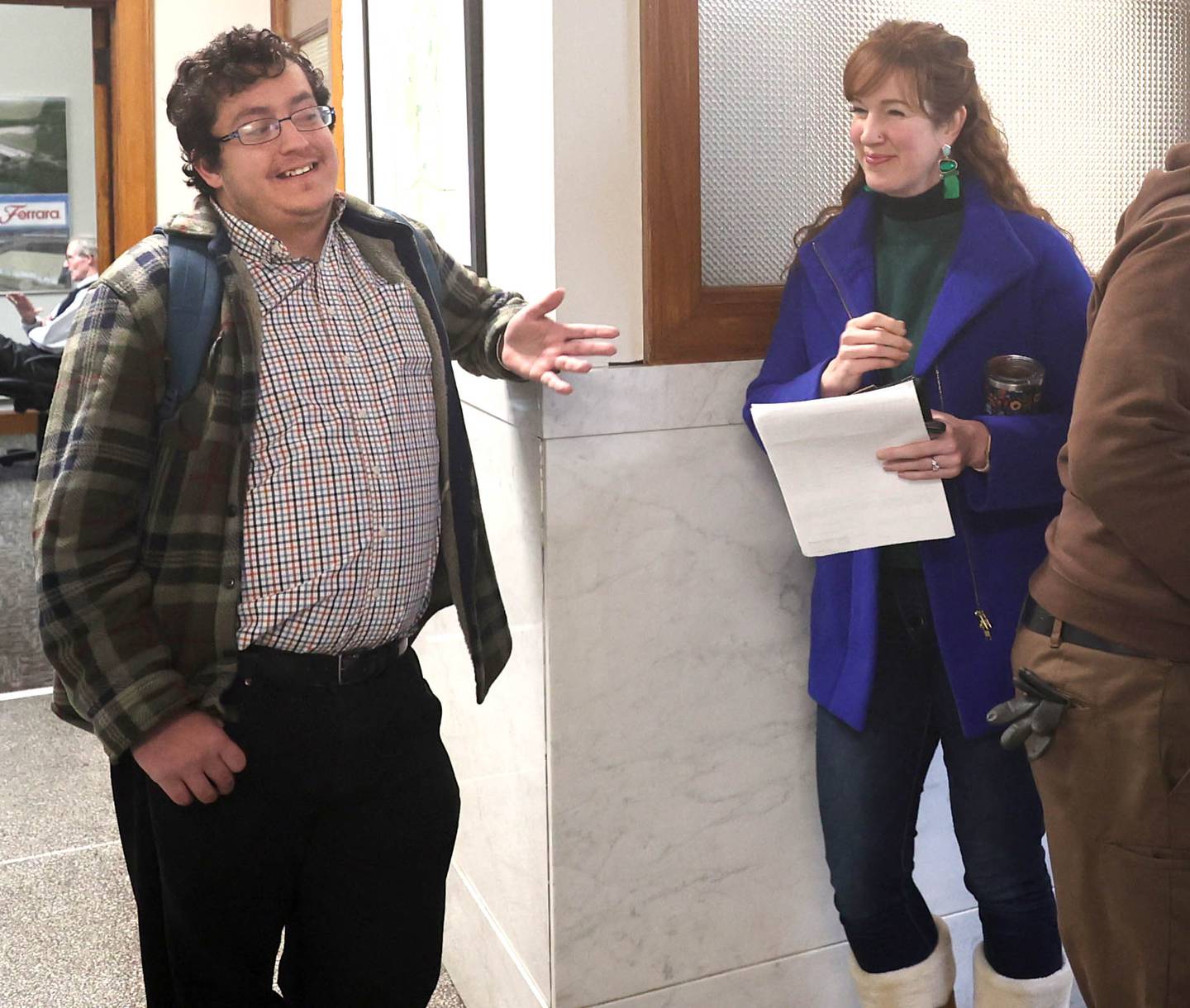 DeKalb City Clerk Sasha Cohen talks to DeKalb Ward 1 alderman Carolyn Morris as she waits to file for re-election Monday, Dec. 12, 2022, at City Hall. Morris was among the first candidates in line at City Hall Monday at 8:30 a.m. when filing opened.