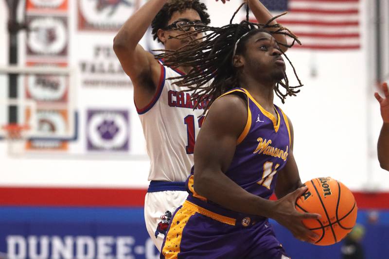 Wauconda’s Kaden Pemberton moves the ball in varsity basketball Friday, Dec. 20, 2024 at Dundee-Crown High School in Carpentersville.
