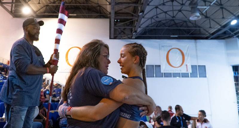 Marengo High School senior Cheyenne Welker celebrates with her mother, Debbie, after winning a fight; Welker won the bronze medal in her division at the WAKO Junior World Championships Oct. 3-9, 2022, in Italy.