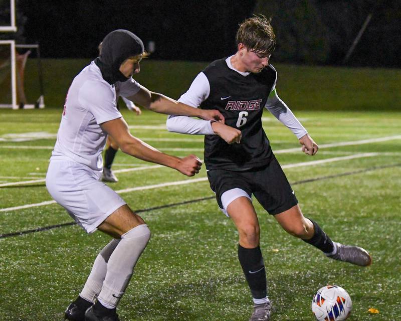 Prairie Ridge's Matthew Rireng, right and Benet' Academys William Khazen battle for the ball during the class 2A super sectional soccer match on Tuesday Nov. 5, 2024, held at Wheaton Academy in West Chicago.