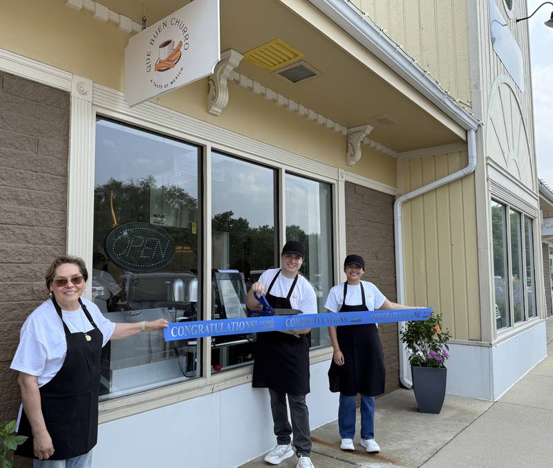 Peter Pacheco (center) cuts the ribbon on Que Buen Churro, 316 Crescent Place, Geneva Aug. 1 with his mother, Alma Pacheco, (left) and his girlfriend Melissa Hernandez. The three run the new store, which sells handmade churros.