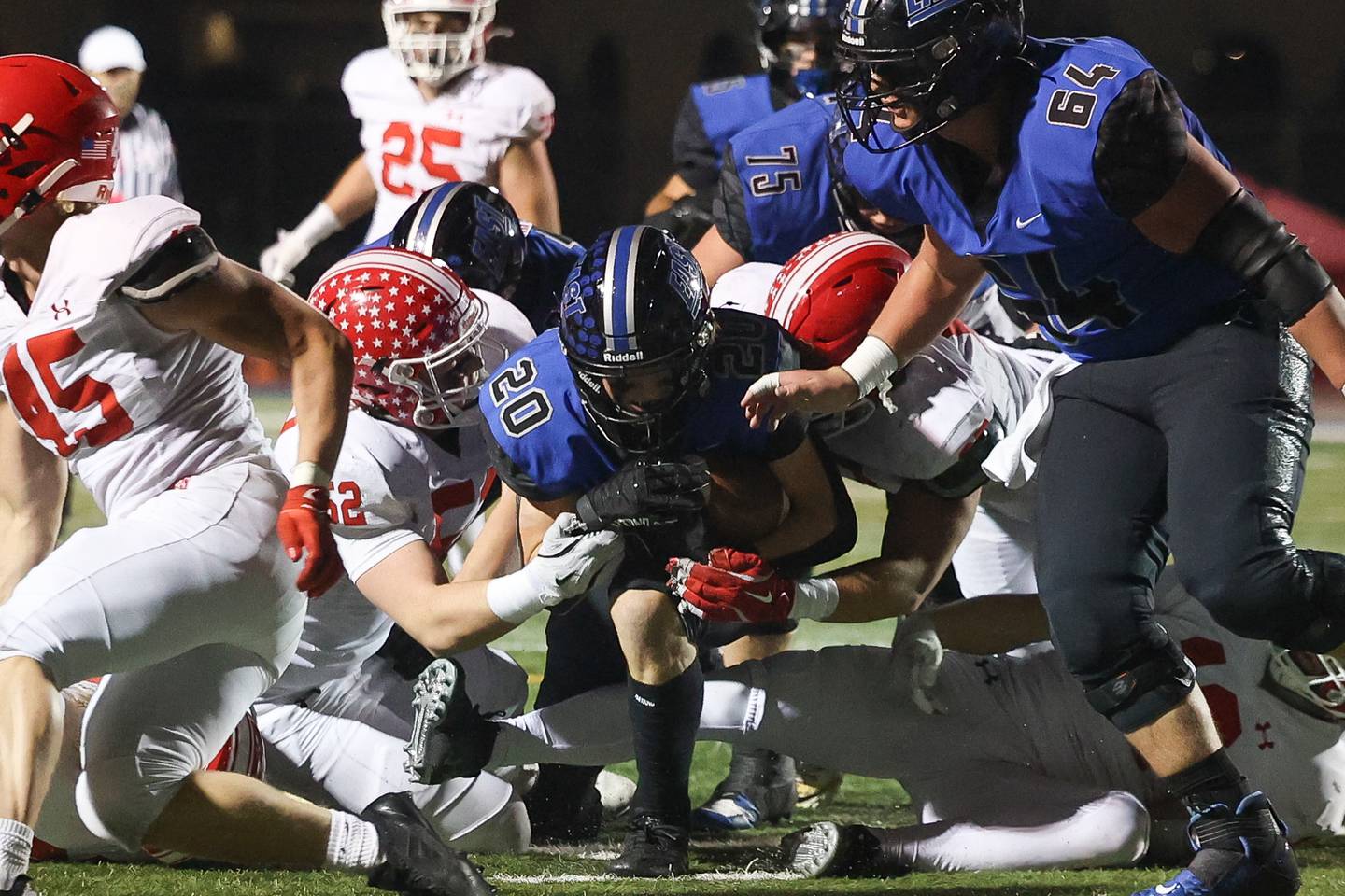 Lincoln-Way East’s Brody Gish powers ahead for extra yards on a run against Naperville Central on Friday, Oct. 25, 2024 in Frankfort.