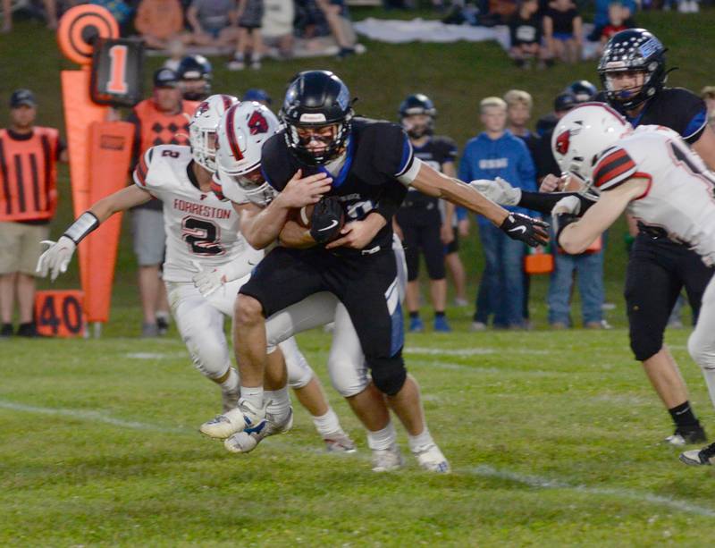 Eastland-Pearl City's Draven Zier (22) fights for yards as Forreston's Dane Setterstrom tries to wrap him up during Friday, Sept. 20, 2024 NUIC Conference action in Pearl City.