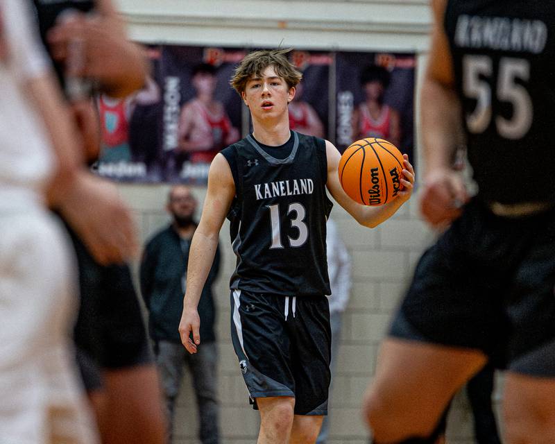 Kaneland's Bryce Goss (13) dribbles ball in game against LaSalle-Peru on Friday, Feb. 20, 2026 in Sellett Gymnasium at L-P High School.