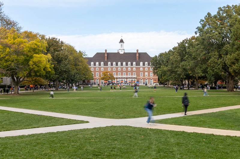 Students walk across the lawn between the Illini Union in the fall of 2024.