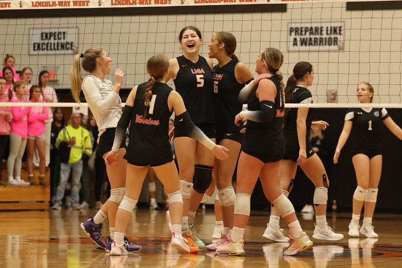 Lincoln-Way West celebrates match point in a three set win over Plainfield North in the Class 4A Lincoln-Way West Regional semifinal on Tuesday, Oct. 29, 2024 in New Lenox.
