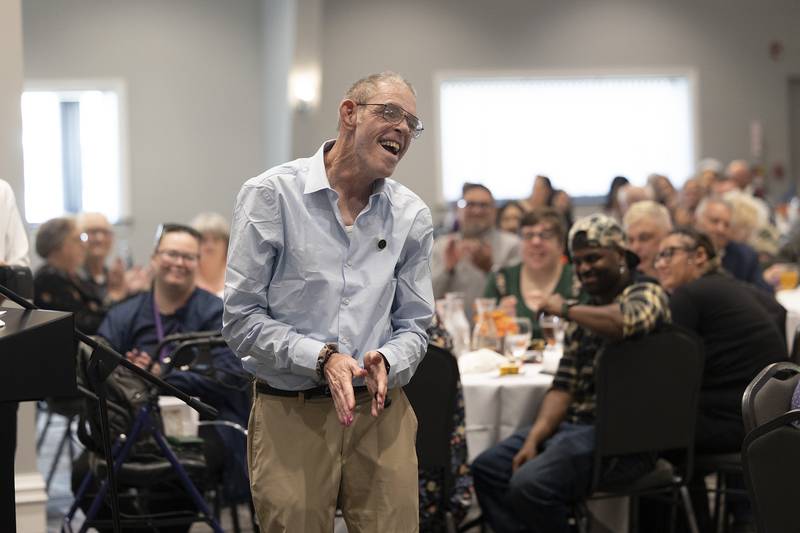 After receiving a 40 year service pin, Brian Carlisle celebrates Thursday, Oct. 16, 2025, during the annual Self Help Awards.