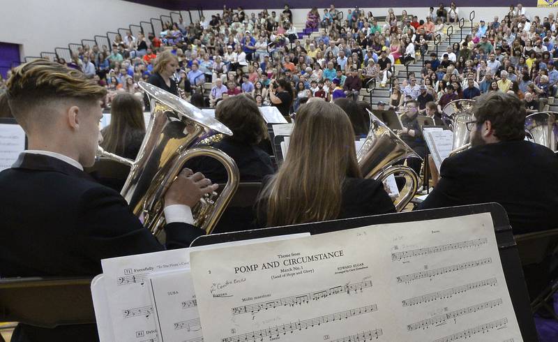 An overflow audience is treated to the standard of “Pomp And Circumstance” performed by the Mendota High School Band as graduates enter the gymnasium Saturday, May 14, 2022, during the graduation ceremony at Mendota High School.