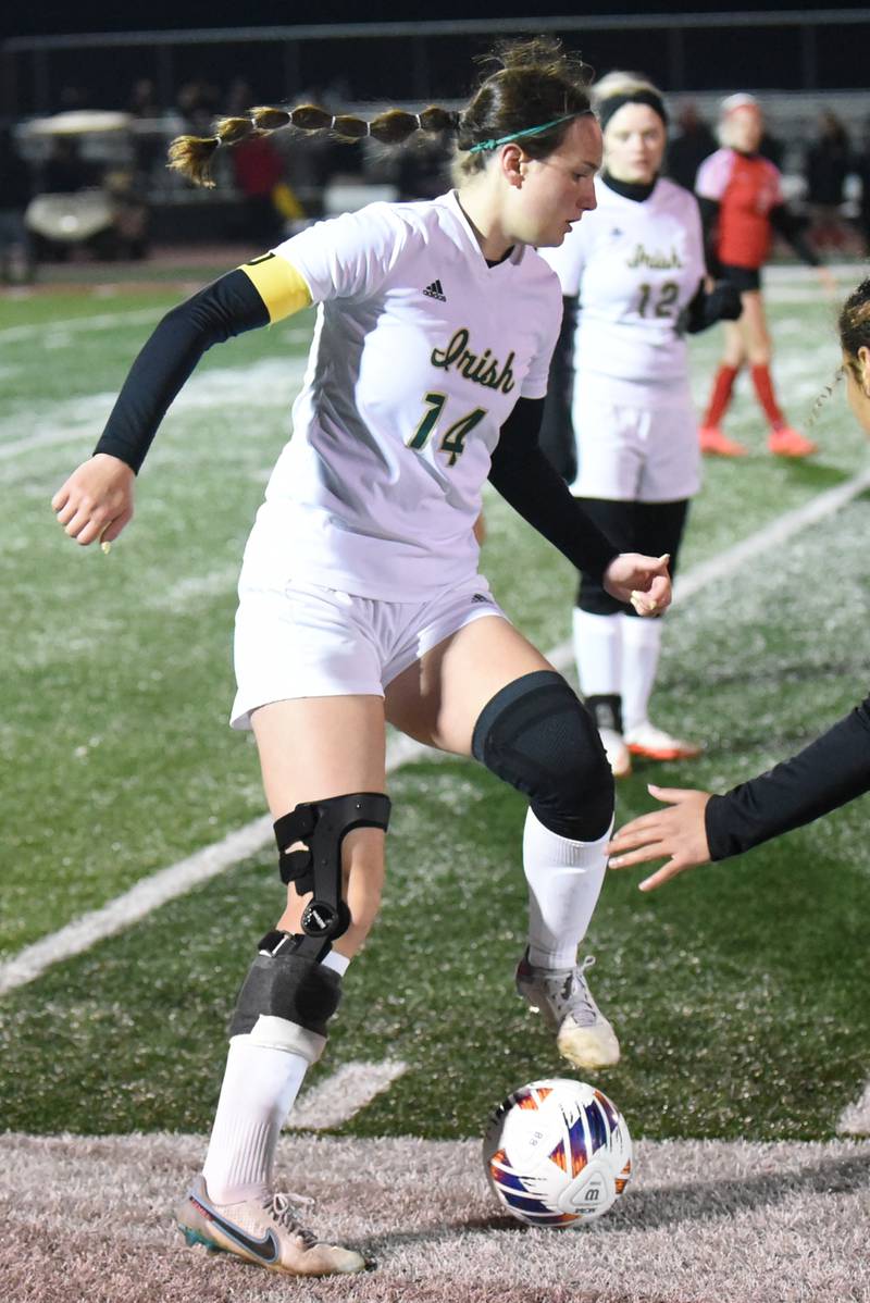 Bishop McNamara's Ella Langellier posseses the ball during a game at Bradley-Bourbonnais Tuesday, April 1, 2025.