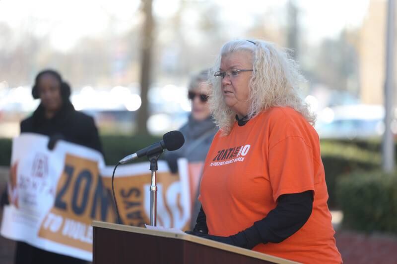 ZONTA Club of Joilet Area President Beth Colvin speaks during a rally for ZONTA Says No To Violence Against Women outside the old court house on Tuesday in Joliet.