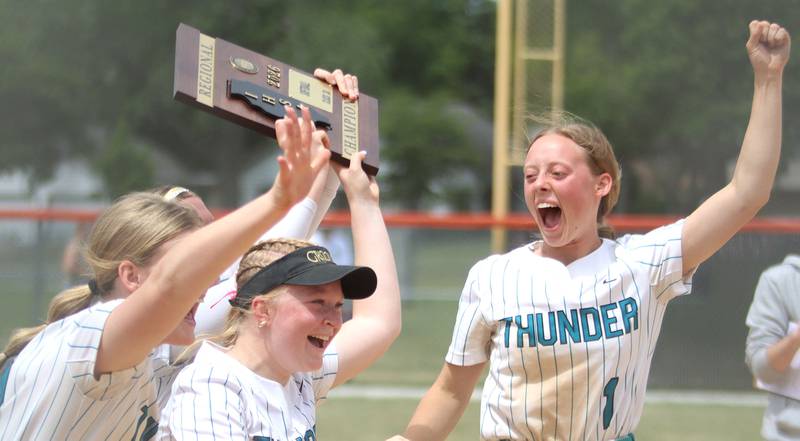 Woodstock North’s Allyson Schaid, right, and the Thunder celebrate a 5-2 win over Crystal Lake Central in IHSA Class 3A Regional Title Game softball action on Saturday, May 23, 2026 at Crystal Lake Central High School in Crystal Lake.