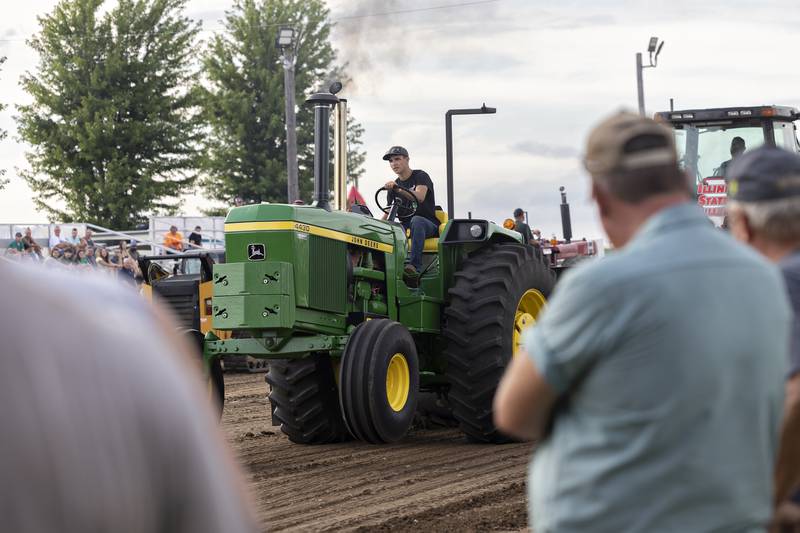 Cameron Folk controls his rig Thursday, July 24, 2025, during his pull at the Lee County Fair.