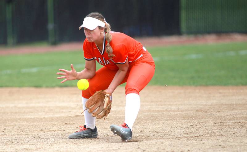 St. Charles East's Addison Wolf grabs a ground ball during a game against St. Charles North on Friday, April 25, 2025 at St. Charles North.