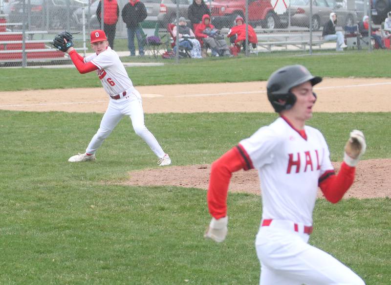 Ottawa's Colin Fowler throws to first base as Hall's Hunter Edgcomb beats out the play on Tuesday, April 1, 2025 at Ottawa High School.