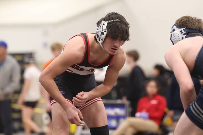 Dominic Recchia of Yorkville faces off with Braeden Grisham of Oswego East in the 138-pound weight SPC Conference championship match at Joliet West on Saturday, Jan 25, 2025.