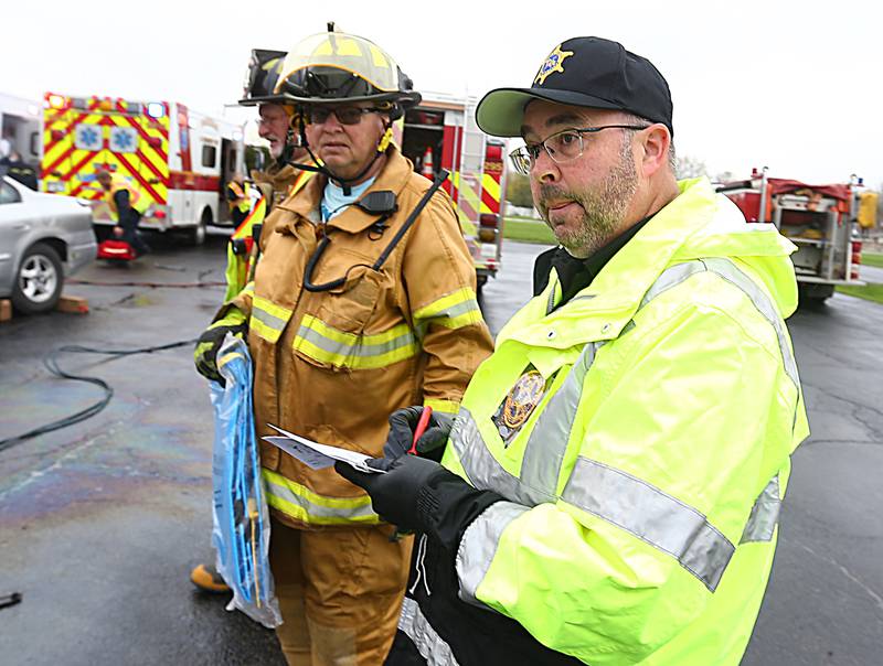 La Salle County Coroner Rich Ploch, is called to a fake scene during Mock Prom drill at Leland High School on Friday, May 6, 2022 in Leland.