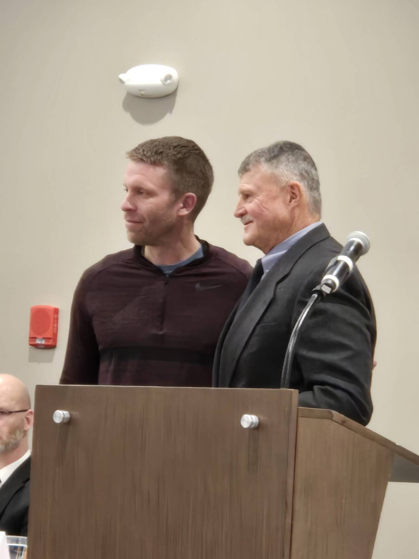 Larry Lokanc (right) is inducted into the IHSFCA Hall of Fame on March 23, 2024