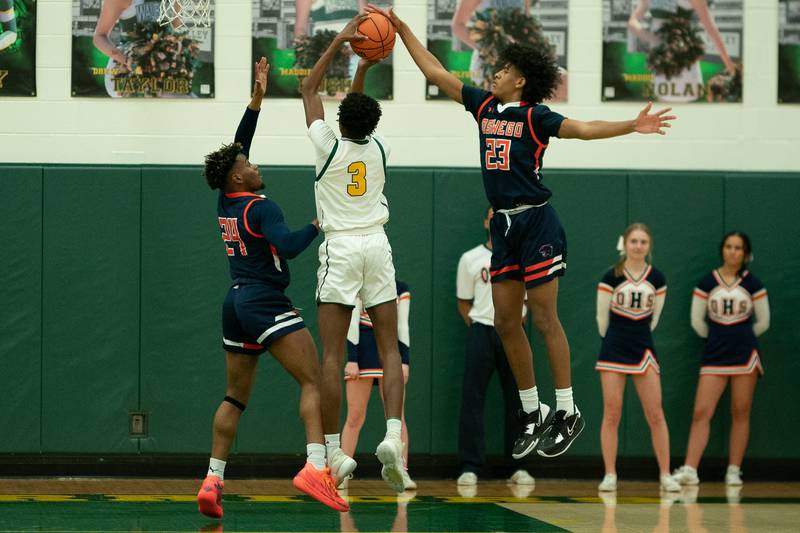 Oswego’s Dasean Patton (23) blocks a shot by Waubonsie Valley's Tre Blissett (3) during a Waubonsie Valley 4A regional semifinal basketball game at Waubonsie Valley High School in St.Charles on Wednesday, Feb 22, 2023.