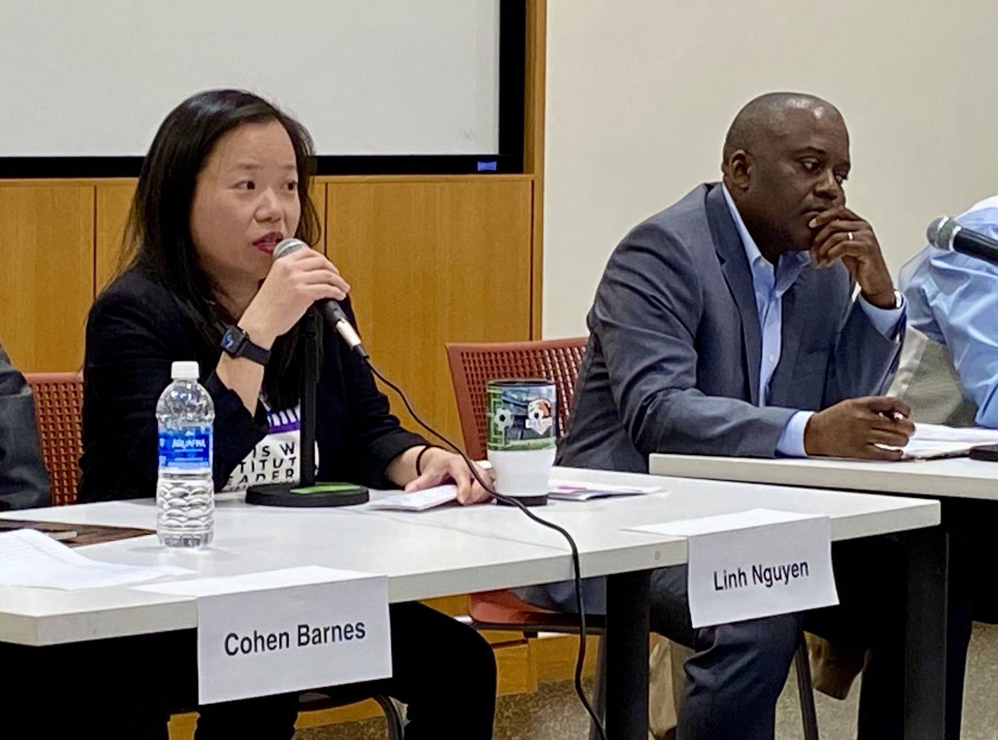 DeKalb candidates for mayor (from left) Linh Nguyen answers an audience question while opponent Koume Sanan listens at a candidate forum hosted by WNIJ and the DeKalb Election Group on Sunday, March 9, 2025, at the DeKalb Public Library, 309 Oak St.