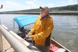 Photos: 'Ageless Wanderer' Robert Youens passes through Starved Rock on a Jon boat