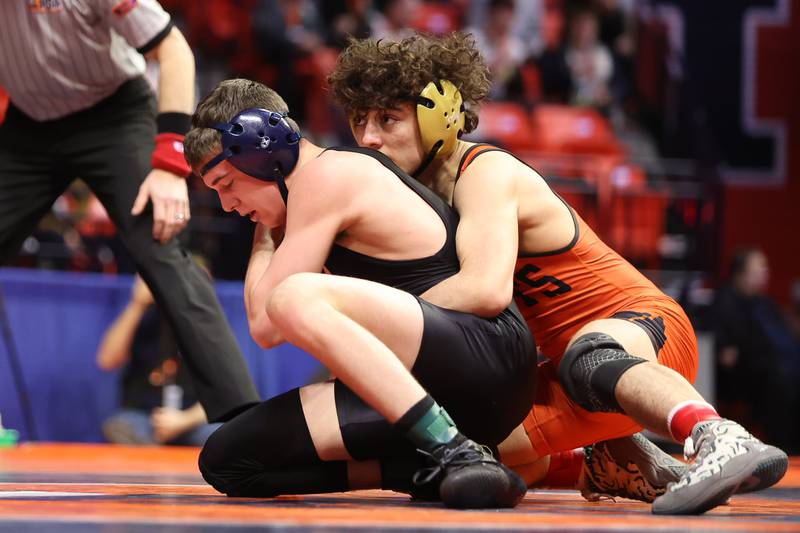 Providence’s Billy Miszner tries to escape St. Charles’ Cody Tavoso in the Class 3A 132lb. 3rd place match at State Farm Center in Champaign. Saturday, Feb. 19, 2022, in Champaign.