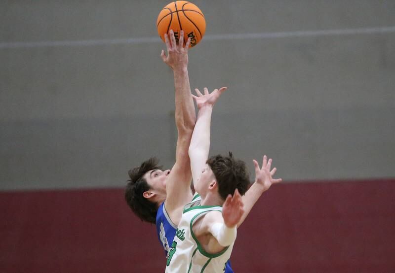 Princeton's Noah LaPorte wins a the opening jump ball over Rock Falls's Ryken Howard during the Class 2A Sectional final on Friday, March 7, 2025 at Marengo High School.
