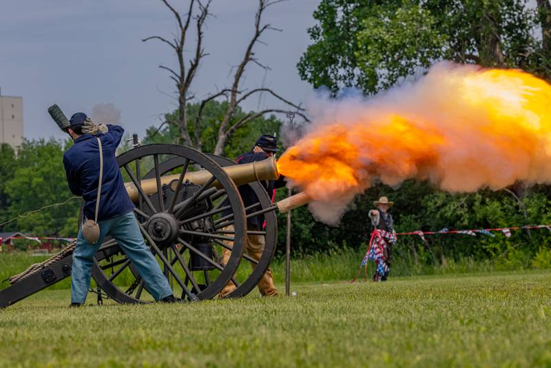 Civil War reenactors fire a canon to open the Buffalo Bill's Wild West Extravaganza during Wild Bill Days on May 31, 2025 at Jamie's Outpost in Utica.