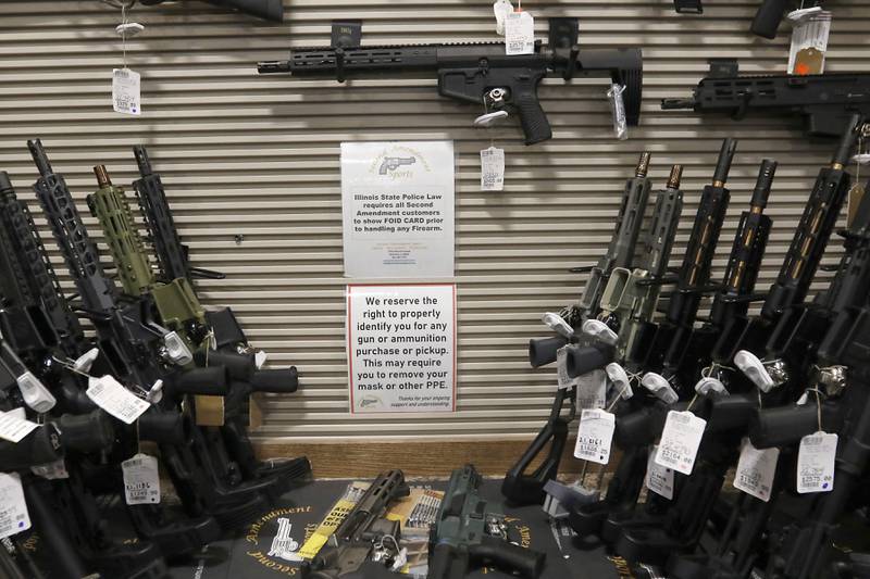 Guns for sale at Second Amendment Sports, in McHenry, on Thursday, Dec. 1, 2022. Democrats  in the state Legislature unveiled a plan that would immediately outlaw the sale of assault weapons and prevent most residents under 21 from legally buying a gun.