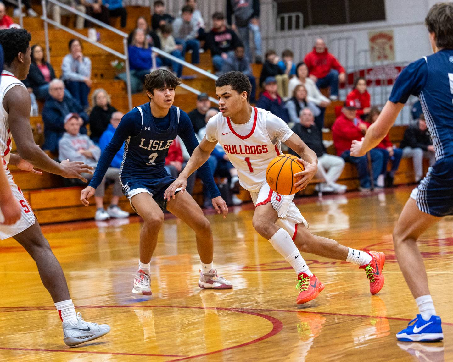 Layzeric Moton (1) of Streator dribbles ball as Lisle's Lucas Bundschuh (3) guards on Wednesday, Feb. 18, 2026 at Streator High School in Streator.