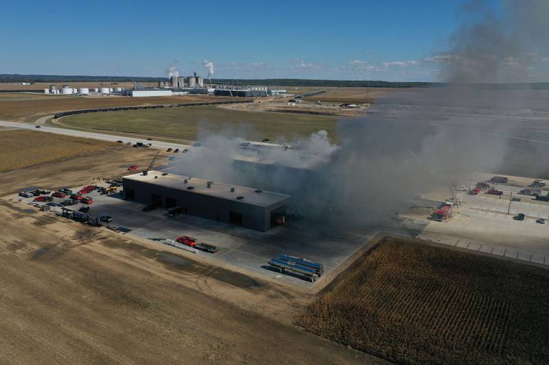 Smoke billows from Marquis Energy as firefighters work to control a structure fire on Wednesday, Oct. 8, 2025 in Hennepin. The fire was upgraded to a 5th alarm dispatching the (MABAS) Mutual Aid Box Alarm System. The fire broke out around 11a.m.