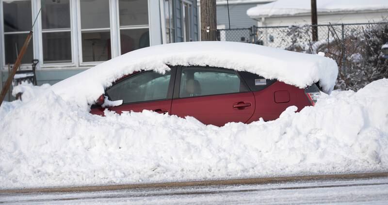 This car was still covered in snow along a Mt. Morris street on Saturday, Jan. 13, 2024. Friday's winter storm dumped 10-12 inches of snow on the village.