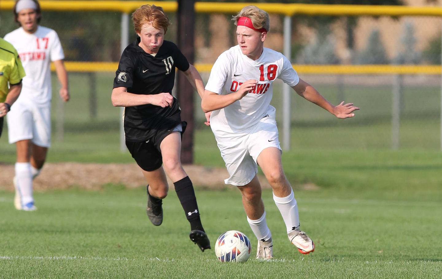 Sycamore's Jameson Carl and Ottawa's Grayson Skinner chase down the ball during their game Wednesday, Sept. 14, 2022, at Sycamore High School.