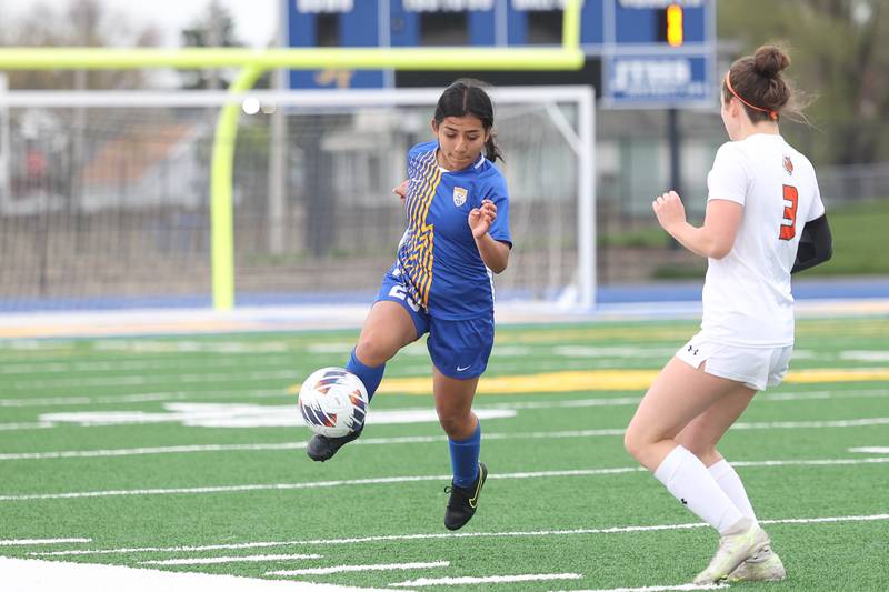 Joliet Central’s Jessenia Chavez works the ball against Plainfield East on Thursday, April 11, 2024.