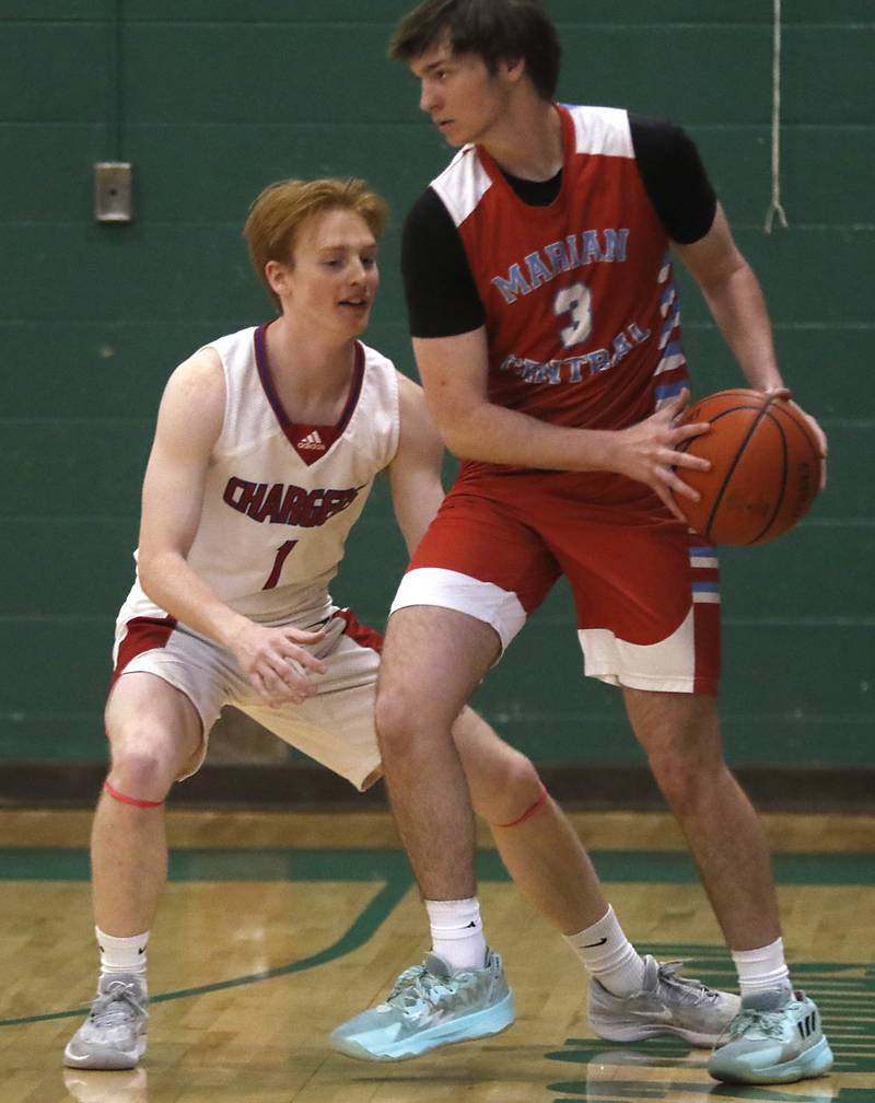 Dundee-Crown’s Zach Randl guards Marian Central's Braedon Todd during the boy’s game of McHenry County Area All-Star Basketball Extravaganza on Sunday, April 14, 2024, at Alden-Hebron’s Tigard Gymnasium in Hebron.