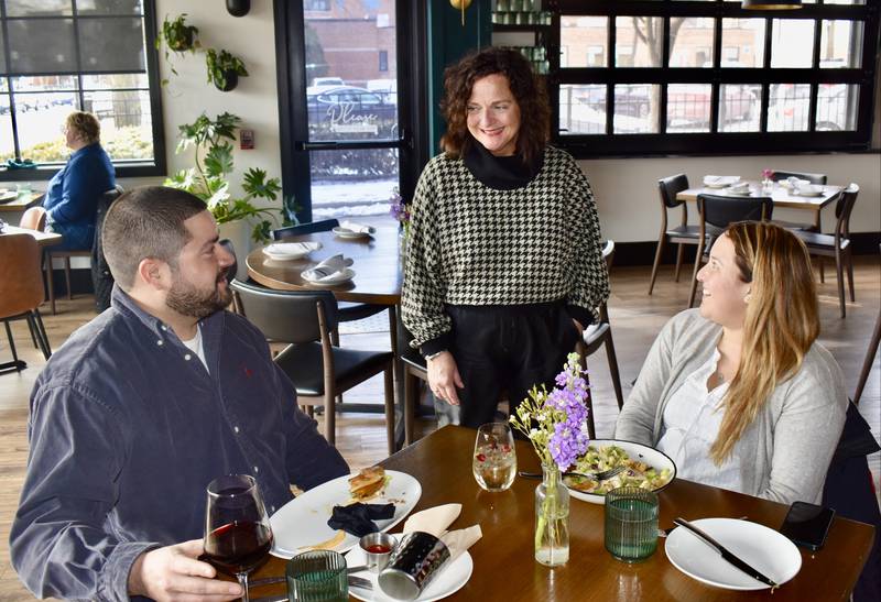 Kristine “Koz” Kostrewa, operations manager at The Elm, visits with Ricardo Razo of Countryside and Christine Saucedo of Brookfield. The Elm is one of 22 participants in the annual La Grange Restaurant Week that runs Feb. 27 through March 9.