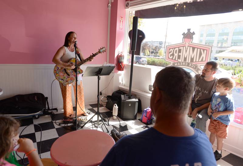 Rebecca Steeling performs kids songs inside Kimmer's Ice Cream Shop during the Music on Main event held downtown Wheaton Saturday, Sept. 21, 2024.