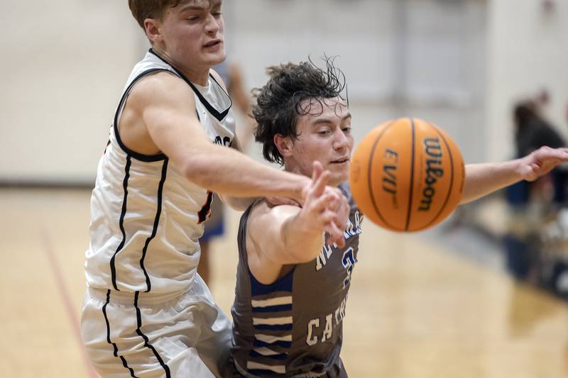 Newman’s Garret Matznick is fouled by Byron’s Ben Hively Friday, Dec. 19, 2025, in the Forreston Holiday Tournament title game.