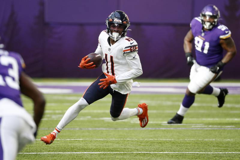 Chicago Bears wide receiver Darnell Mooney runs up field after catching a pass during the first half against the Minnesota Vikings, Sunday, Jan. 9, 2022, in Minneapolis.