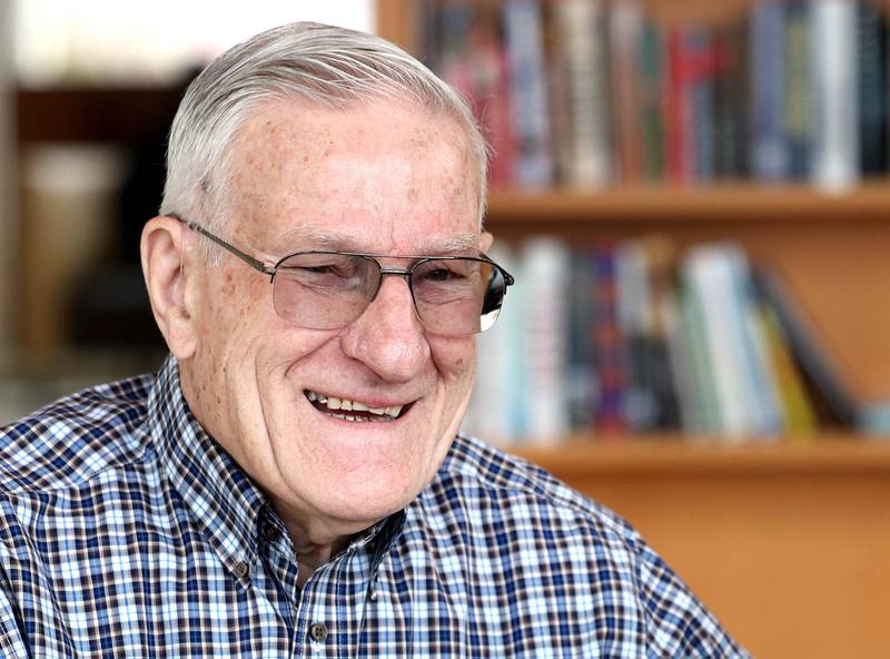 Longtime DeKalb Public Library volunteer Paul Mandigo, 83, talks Wednesday, March 25, 2026, at the facility about why he enjoys helping out at the library.