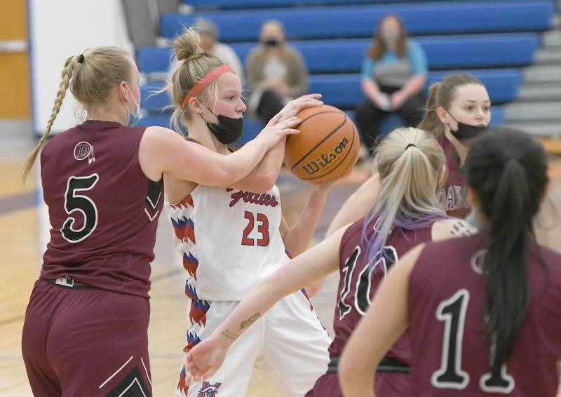 Morrison's Diana Robbins battles two Dakota players during Saturday's Northwest Illinois Girls' Shootout at Eastland High School. Morrison won the game 56-38.